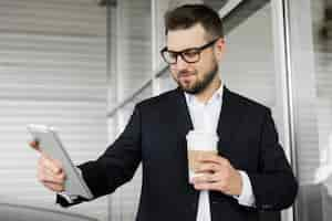 Free photo businessman enjoying day at the office