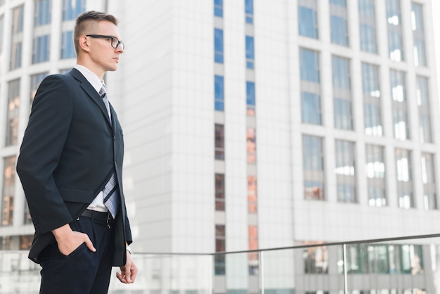 Businessman in front of building