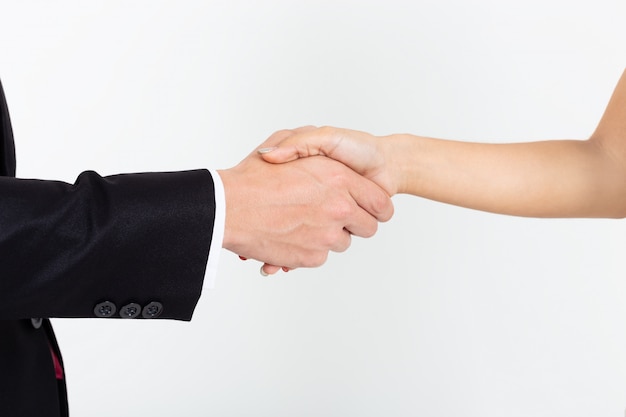 Businessman handshake with young secretary woman on white 