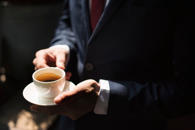 A businessman  having coffee