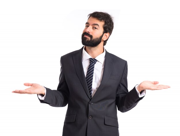 Businessman having doubts over isolated white background