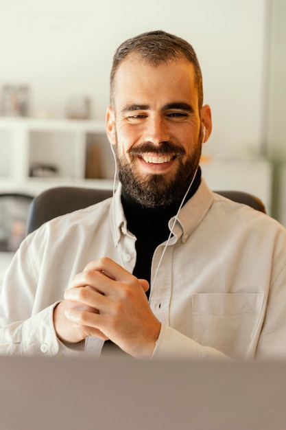 Businessman having a videocall for work