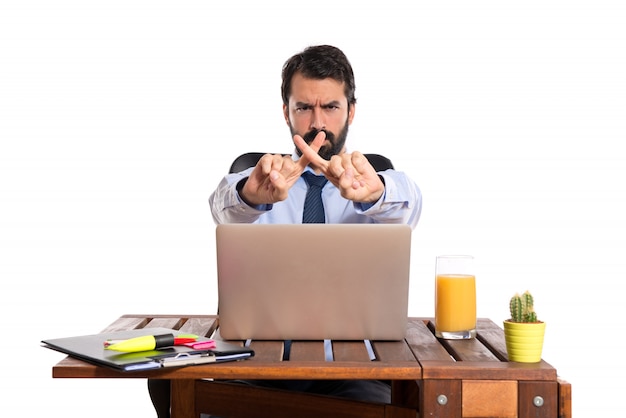 Free photo businessman in his office doing no gesture