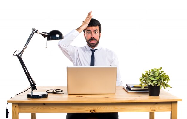 Businessman in his office having doubts