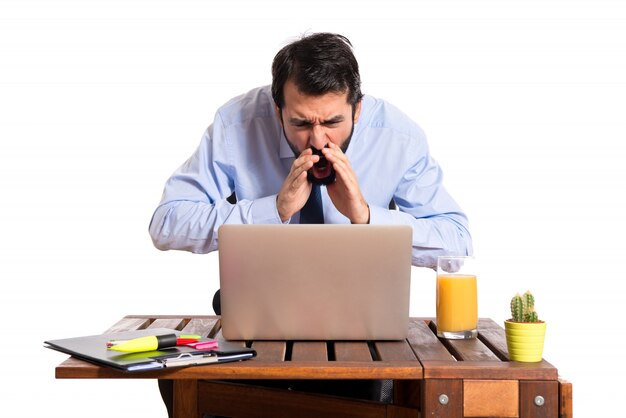 Businessman in his office shouting