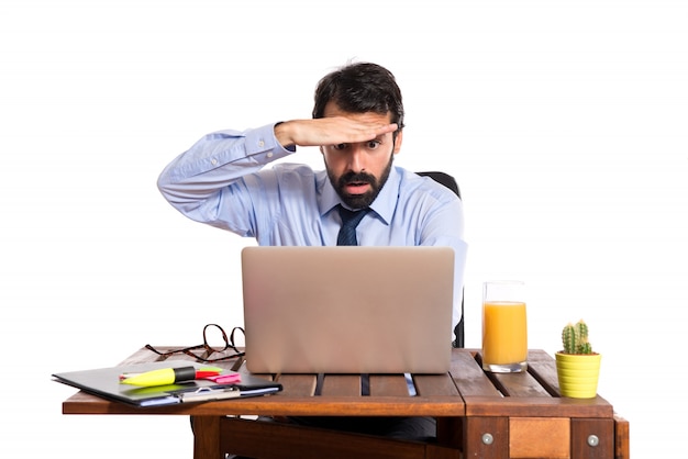 Businessman in his office showing something