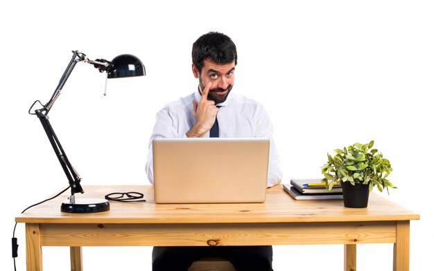 Businessman in his office showing something