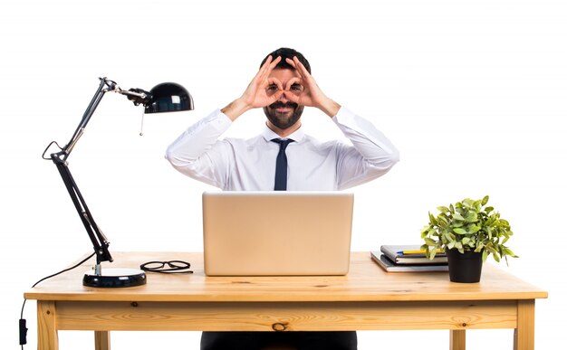 Businessman in his office showing something