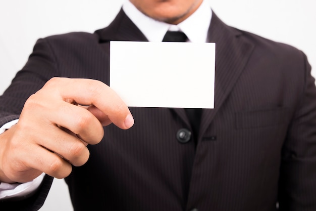 Businessman holding a blank business card