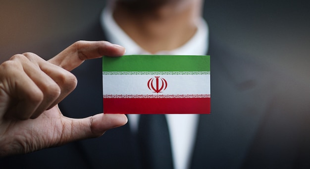 Download Free Businessman Holding Card Of Iran Flag Premium Photo Use our free logo maker to create a logo and build your brand. Put your logo on business cards, promotional products, or your website for brand visibility.