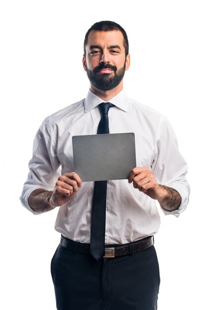 Businessman holding an empty placard