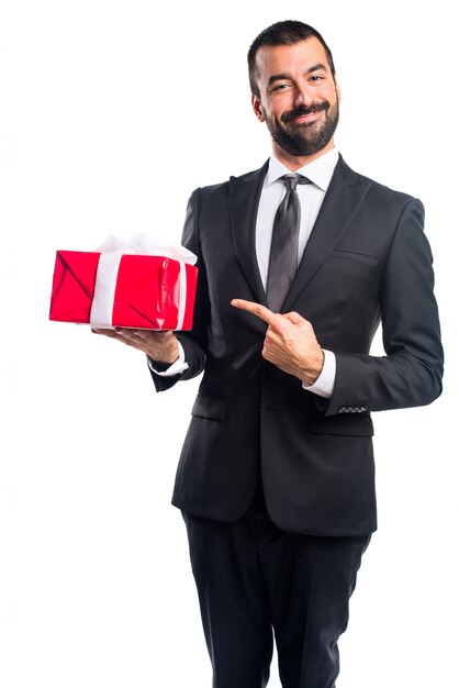 Businessman holding a gift