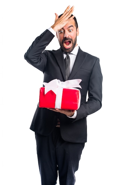 Free photo businessman holding a gift