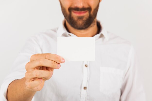 Businessman holding visit card