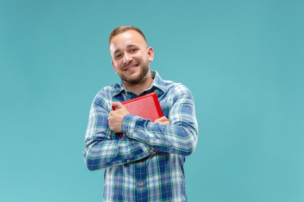 Businessman hugging laptop