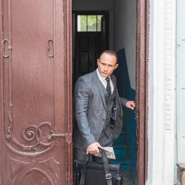 Businessman locking door