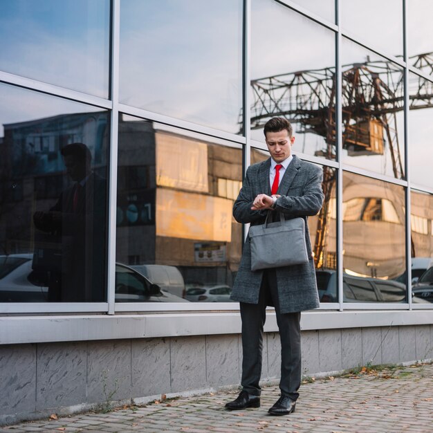 Businessman looking at his watch