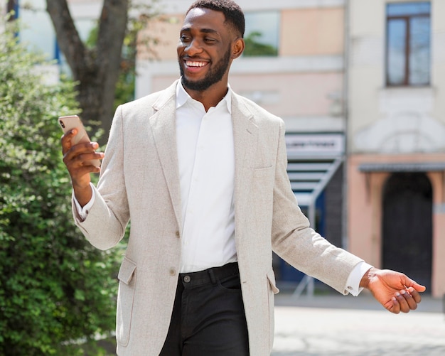 Businessman looking on smartphone