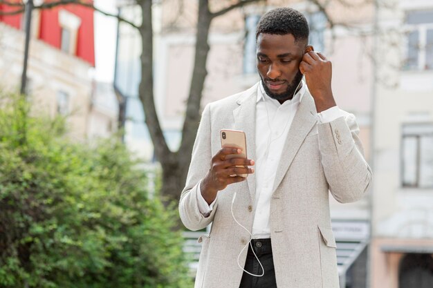 Businessman looking on smartphone