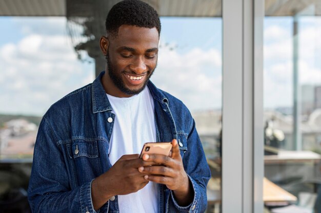 Businessman looking on smartphone