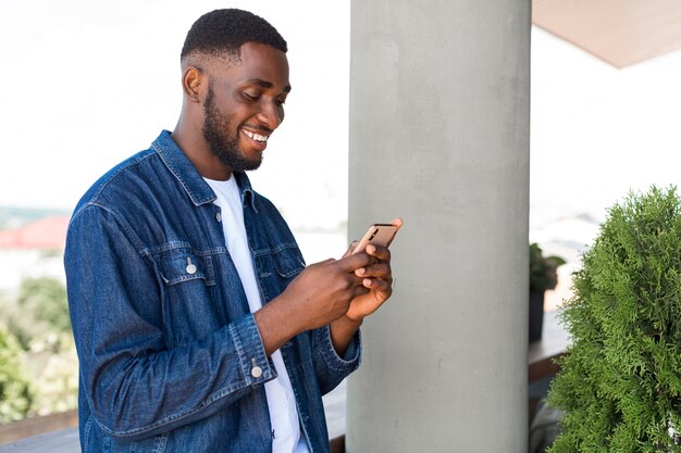 Businessman looking on smartphone