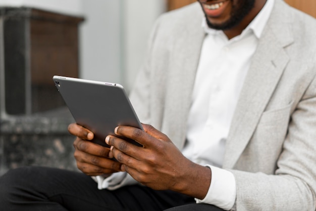 Businessman looking on a tablet
