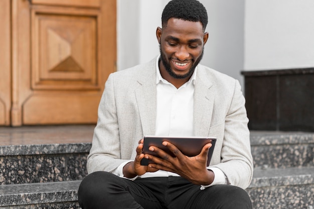 Free photo businessman looking on a tablet