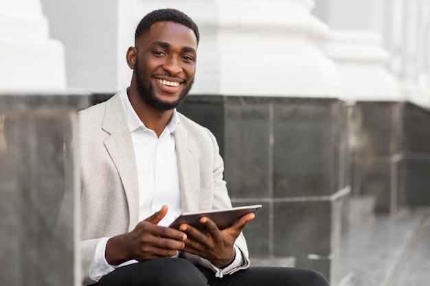 Free photo businessman looking on a tablet