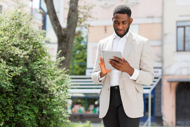 Businessman looking on tablet