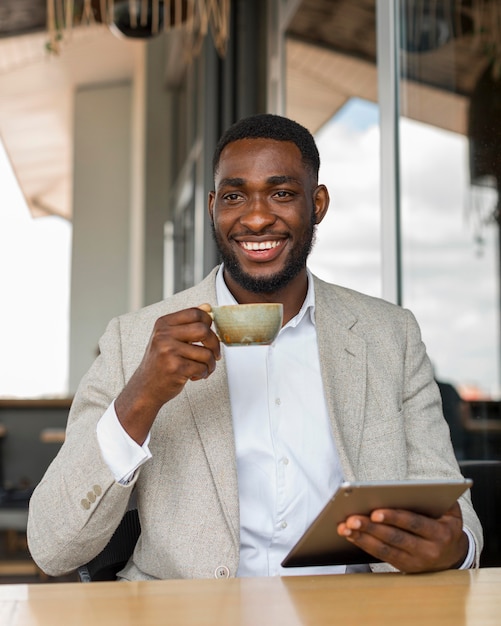 Businessman looking on tablet