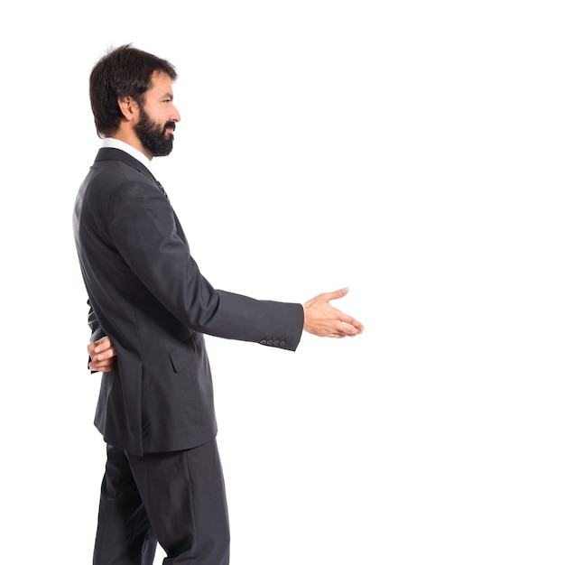 Businessman making a deal over isolated white background