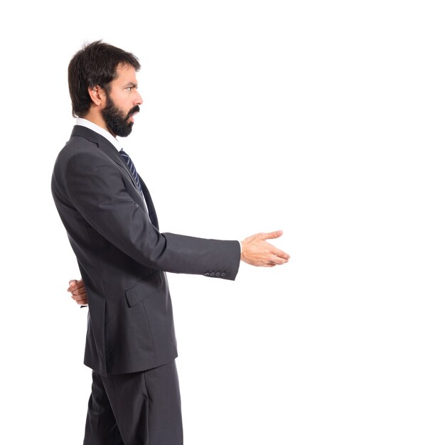Businessman making a deal over isolated white background