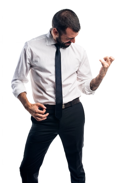 Free photo businessman making guitar gesture