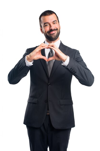 Businessman making a heart with his hands