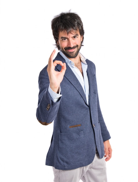 Free photo businessman making ok sign over white background