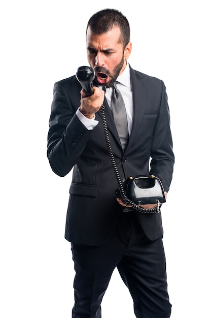 Foto gratuita uomo d'affari che fa il gesto del telefono