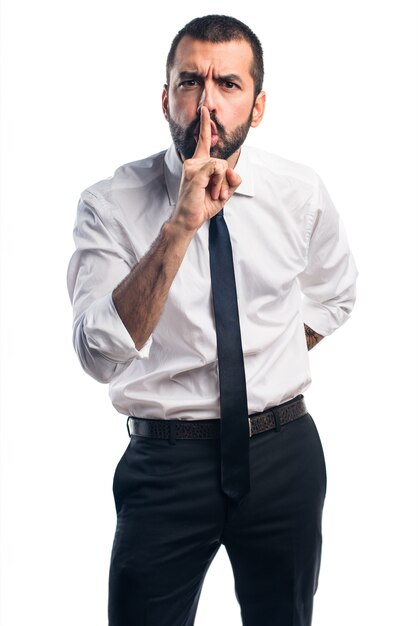 Businessman making silence gesture