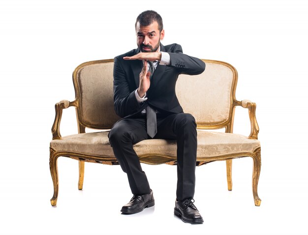 Businessman making time out gesture