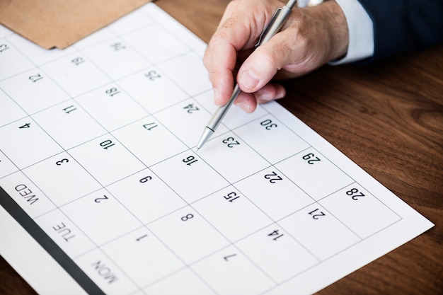 Businessman marking on calendar for an appointment