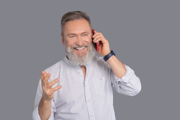 Businessman. Mature man with a smartphine in hands