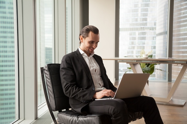 Businessman monitors financial indicators online