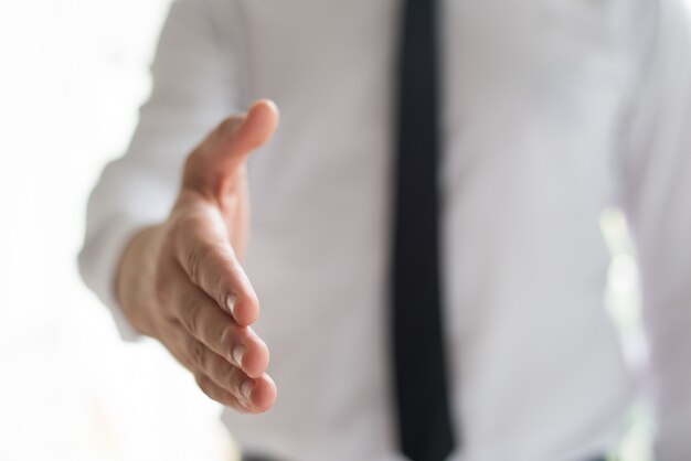 Businessman offering hand for handshake