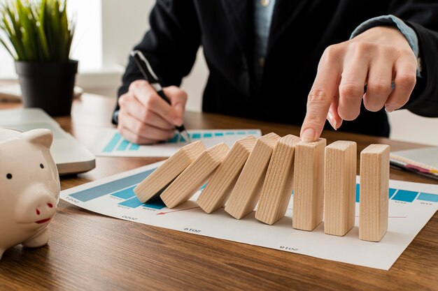 Businessman at the office with wooden blocks