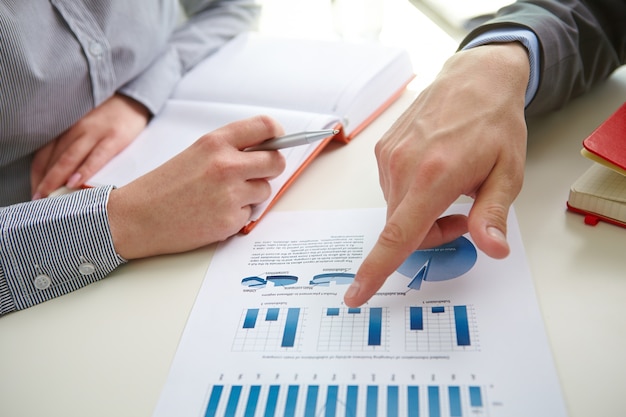 Businessman pointing a bar graph