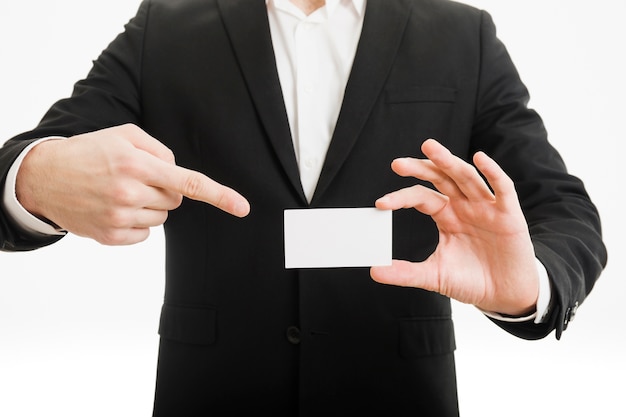 Businessman pointing at business card