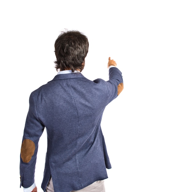 Free photo businessman pointing to the lateral over white background