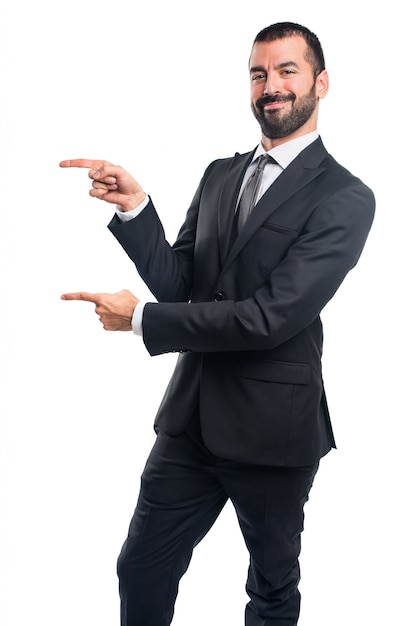 Businessman pointing to the lateral