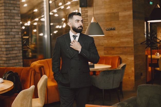 Businessman posing in a cafe
