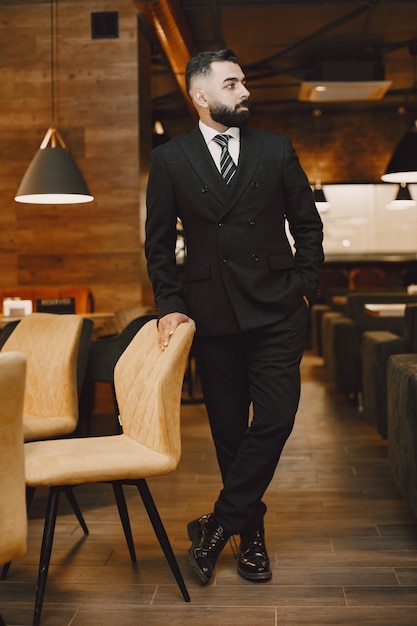 Businessman posing in a cafe