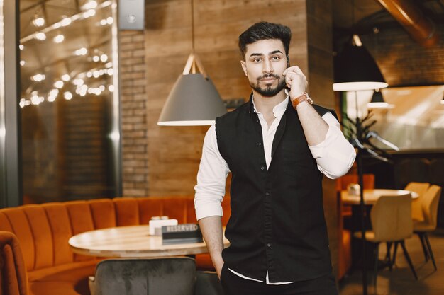 Businessman posing in a cafe